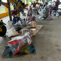Parts being wrapped on sheets of cardboard