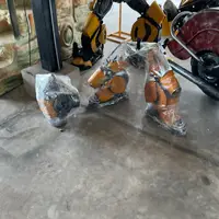 Yellow leg parts, each wrapped in stretch film